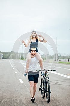 Couple riding their bikes in their free time and having fun on sunny autumn day.