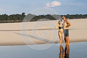 Couple at the Rio Negro in the Amazon of Brazil