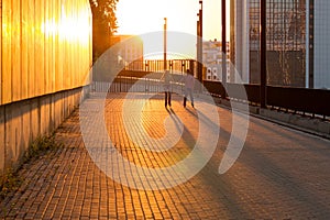 Couple rollerblading at sunset.