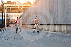 Couple is rollerblading.