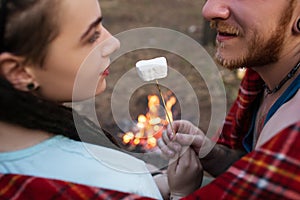 Couple romance nature picnic marshmallows concept.