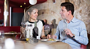 couple on romantic date drinking red wine