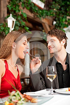 Couple on romantic date at a restaurant