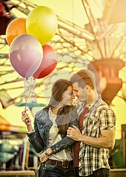 Couple at romantic dating in amusement park