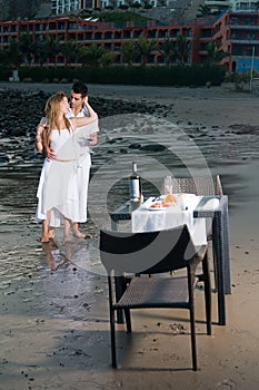 Couple at a romantic dinner in the beach