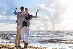 Couple in romantic sunset on ocean beach