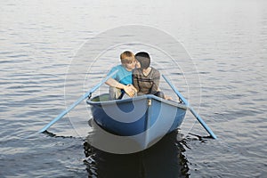 Couple In Rowboat At Lake photo