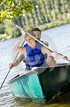 Couple rowing boat