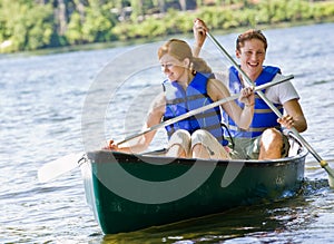 Couple rowing boat