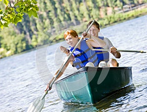 Couple rowing boat