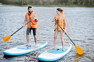 Couple rowing on the stand up paddleboard