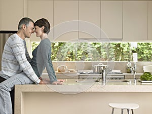 Couple Rubbing Noses In Kitchen