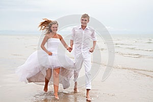 Couple running on a beach