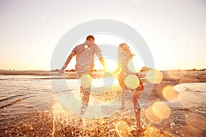 Couple running on the beach