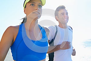 Couple, running and fitness in beach, workout and active with smile, training and sunrise for run. Man, woman and