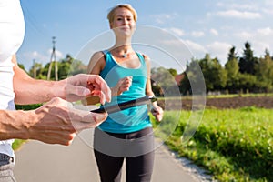 Couple running, sport jogging on rural street