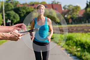 Couple running, sport jogging on rural street