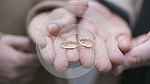 Couple`s Hands Showing Engagement Rings