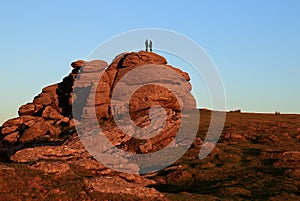 Couple on Saddle Tor at Sunset