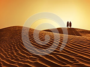 Couple in sahara desert photo