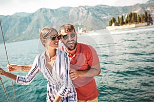 Couple on a sail boat in the summer.