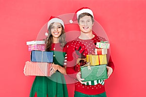 Couple in santa hats with gifts