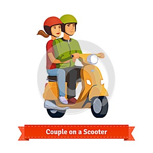 Couple on a scooter. Happy riding together