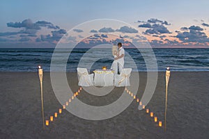 Couple at sea beach during luxury romantic dinner