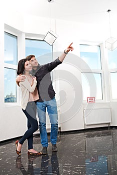 Couple in searching the real estate for a purchase