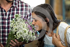 Couple selecting flowers at florist shop