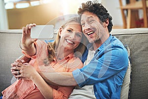 Couple, selfie and couch in home, happy and excited for memory with bonding for love with connection. People, man and