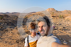 Couple selfie in the desert, Namib Naukluft National Park, Namibia road trip, travel destination in Africa.