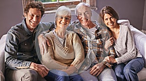Couple, senior parents and portrait on couch with smile, hug and care with bonding, relax and pride in home. Father