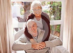 Couple, senior and portrait with hug, window and home for happy retirement. Mature man, woman and marriage with elderly