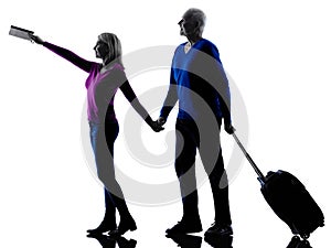 Couple senior travelers traveling silhouette