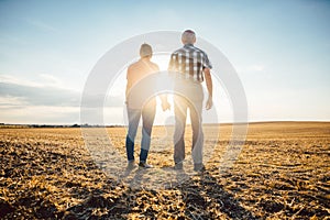 Couple of senior woman and man having an evening stroll