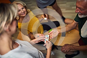 Couple seniors taking medication and vitamins before gym workout