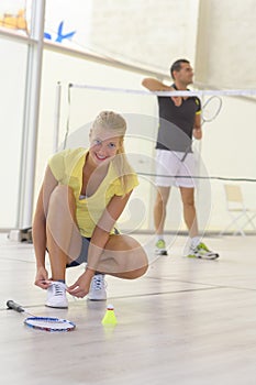 Couple with set badminton equipment