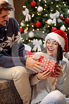 Couple sharing gifts and spending Christmas together