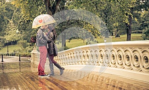 Couple sharing romantic emotions in a rainy day