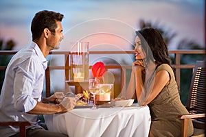 Couple sharing romantic sunset dinner