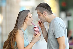 Couple sharing a takeaway refreshment