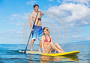 Couple Sharring Stand Up Paddle Board