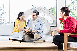 Couple with shop assistant in furniture store