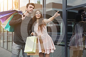 Couple with shopping bags outdoors photo