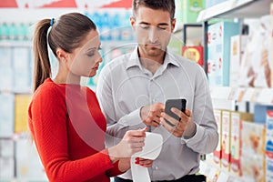 Couple shopping and checking a receipt