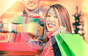Couple shopping Christmas presents in mall