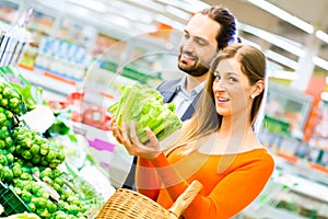 Couple shopping groceries in supermarket