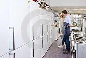 Couple shopping for a new fridge