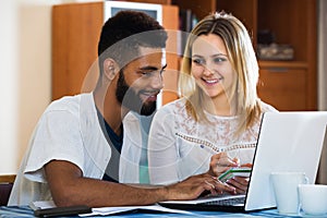 Couple shopping online at home